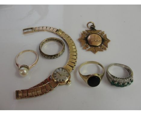 A quantity of gold items: Ring Watch and medallion