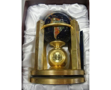 A semi-precious stone globe, on gilded stand with a clock