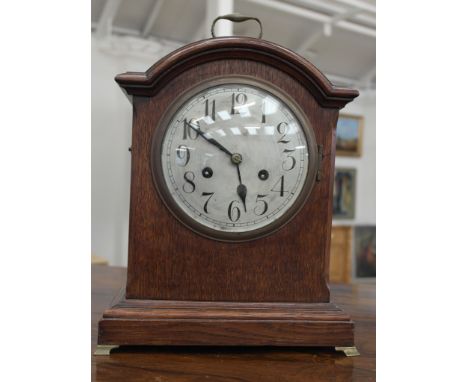 An early 20th century oak-cased mantel clock
