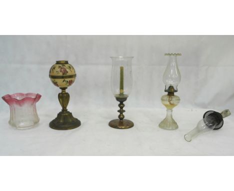 A Victorian brass lamp; together with two other examples