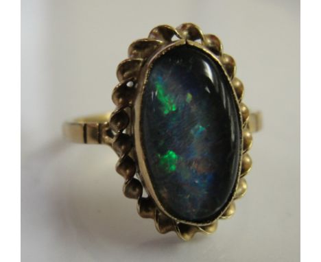 A 9ct black opal dress ring