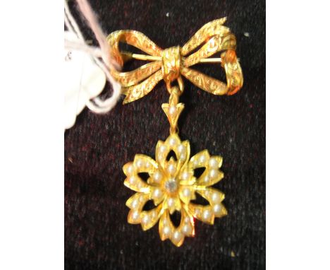 A Victorian 15 ct and 9 ct suspension mounted seed pearl floral brooch