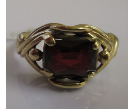 A 9ct garnet set dess ring