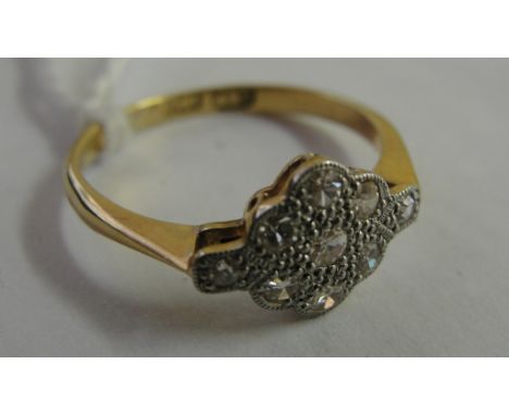 An 18ct Edwardian diamond cluster ring