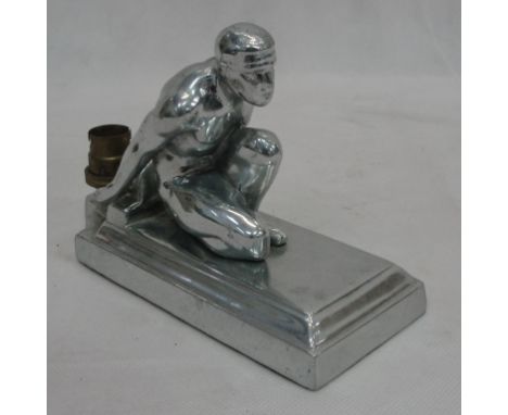 An American silvered lamp in the form of a kneeling man