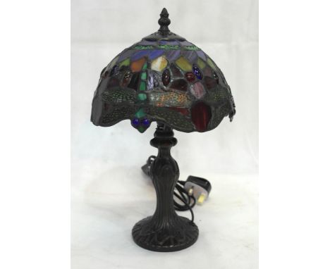 A small Tiffany-style dragonfly lamp