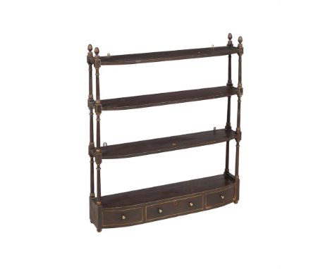 A FLIGHT OF EBONISED WALL SHELVESCIRCA 1830Of bowfront outline, the lowest shelf with arrangement of drawers95cm high, 83cm w