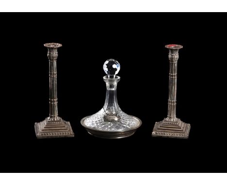 A PAIR OF ELECTRO-PLATED CANDLESTICKSWith gadrooned shaped circular sconces, foliate baluster capitals, lobed stems and stepp