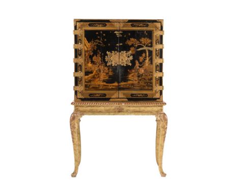 A BLACK AND GILT CHINOISERIE CABINET ON STANDEARLY 18TH CENTURY AND LATERThe interior partially removed 173cm high, 106cm wid