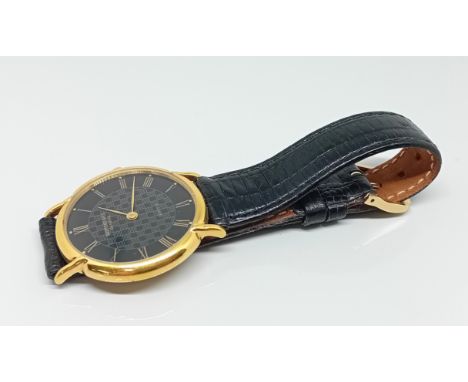 A Gentleman's Raymond Weil quartz watch, with electroplated back, and black leather straps.