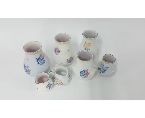 A collection of Poole pottery.