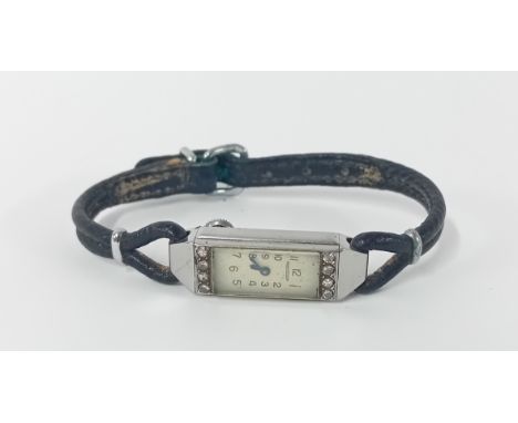 A Jeager-le-Couture women's wristwatch, rectangular Arabic dial with white stone decoration, on a black leather strap.
