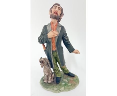 A Capi-di-monte porcelain figure of a street singer, signed Defendi, and a plumed 'N' stamp, height 25cm.