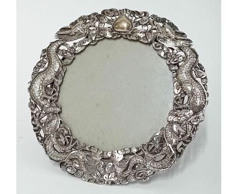 A Chinese silver circular easel Photo Frame, the frame pierced with dragons and flaming pearl by Luen Wo, 12cm diameter. Plea