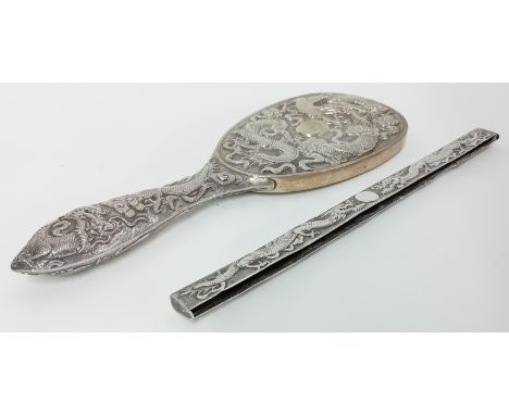 A Chinese silver oval Brush Back and Comb Back with coiled dragons in relief by Tuck Chang of Shanghai (incomplete). 6.29oz. 