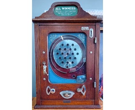 A rare 1890's/early 20th century Arcade Machine, All Winners Allwins type flick a ball coin operated machine, with blue and b