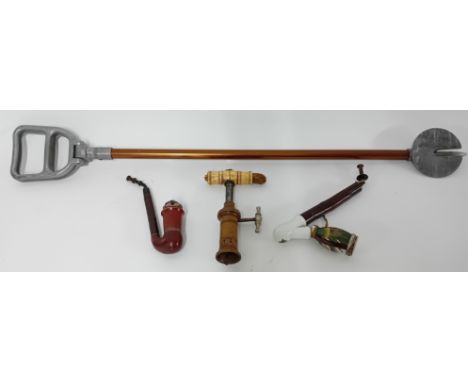 A bone handled corkscrew with patent mark to base, together with two pipes, and a shooting stick. (4)