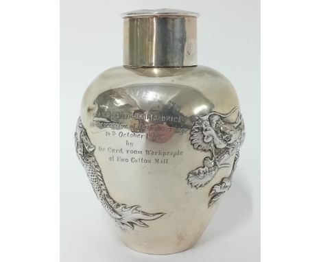A Chinese silver ovoid lidded Tea Caddy with four toed dragons in high relief, engraved 'Presented to Mr &amp; Mrs Edwin B.Br