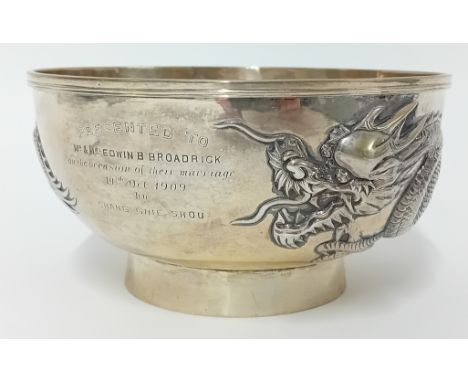 Chinese silver Bowl, decorated with three toed dragon in relief, Luen Wo, Shanghai, 17cm, inscribed 'Presented to 'Mr & Mrs E
