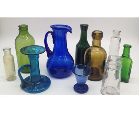 Collection of vintage clear, coloured glass bottles and art glass vases