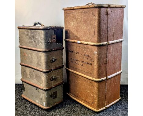Pair of both canvas and leather-covered vintage trunks utilising sturdy metal hardware, leather accents and original handles 