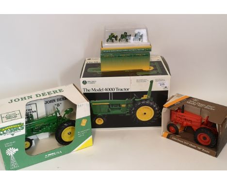 4 x Die Cast Collectors tractors.John Deere 1947 model M tractor, 1:16 scale.John Deere model B tractor, 1:16 scale.John Deer