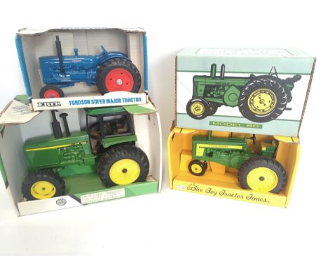 4 x Die Cast Collectors Tractors.John Deere 4455 MFWD tractor, 1:16 scale.John Deere 720 tractor, Collectors Edition, 1:16 sc