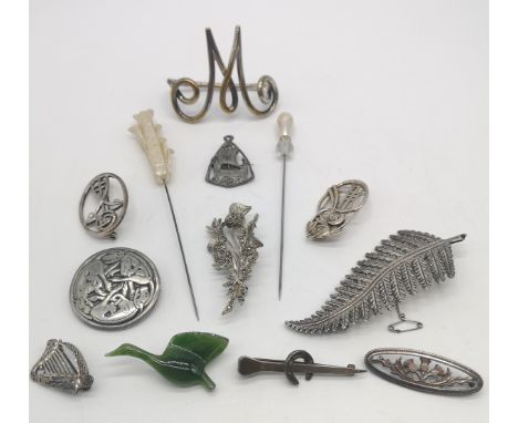 Collection of silver and white metal jewellery; ladies brooches, hat pins and a nephrite jade goose brooch