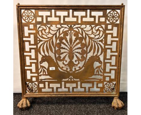 Cast metal antique fire screen with a pierced decorative centre panel raised on hairy paw feet [73.5x79x23cm]