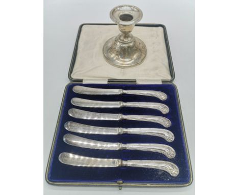 Cased set of 6 silver handled knives together with a Birmingham silver weighted candlestick