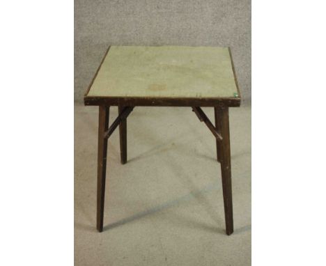 A vintage folding card table with makers label to the underside. H.71 W.62 D.62cm. 