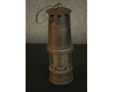 A Patterson Lamps Ltd Gateshead on Tyne miner's lamp. L.25 Dia.8cm.