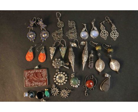 A collection of gem set earrings, pendants and other jewellery. The earrings are set with lapis lazuli, opal glass, abalone, 