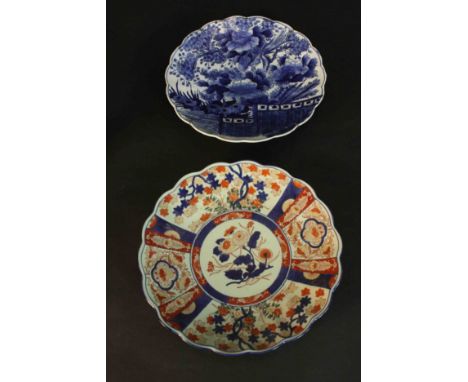 Two 19th century scalloped edged Japanese ceramic plates. One Imari style with stylised flowers and foliage four character ma