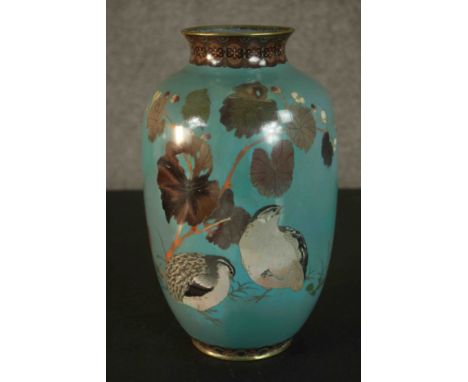 A Meji period Japanese cloisonne enamel baluster vase decorated with a pair of quail under a flowering plants. Geometric patt