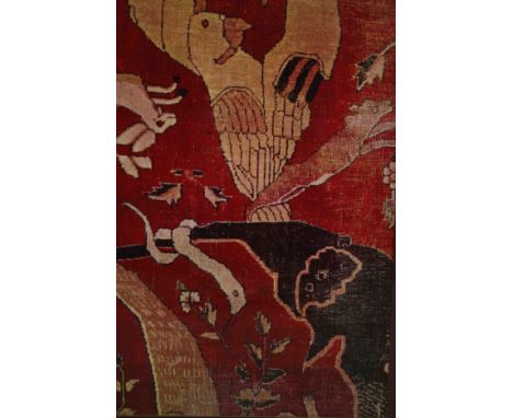 A carved framed and glazed print of a tapestry of various animals. H.98 W.83cm.