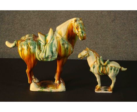 Two Tang dynasty style ceramic horses with applied green and ochre glazes. H.40 W.43 D.18cm. (largest)