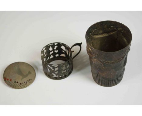 A German repoussé swag design silver cup by C.E.Geyser along with a silver and enamel circular bird brooch and a pierced whit