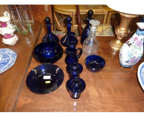 A 19th Century glass decanter together with a quantity of blue glass decanters and bowls etc.