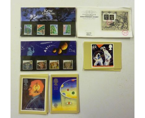 A box of first day covers; cigarette cards etc.