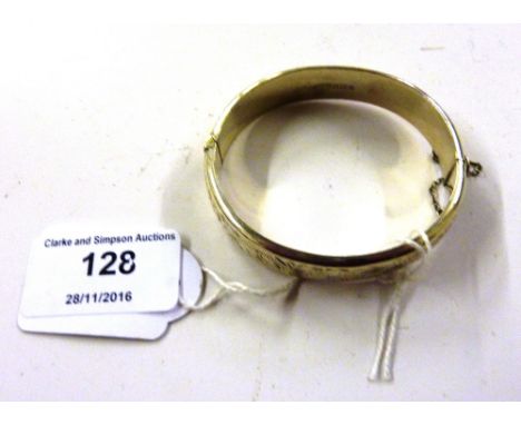 A silver foliate engraved bangle