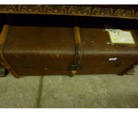 A wooden bound travelling trunk
