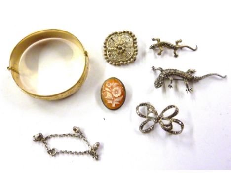 A rolled gold bangle; three marcasite brooches; a Cameo brooch etc.
