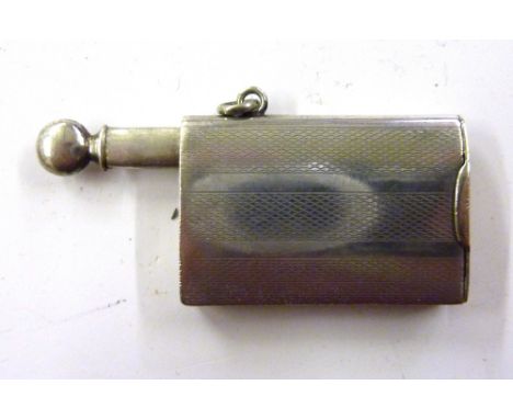A silver tinder lighter with engine turned decoration