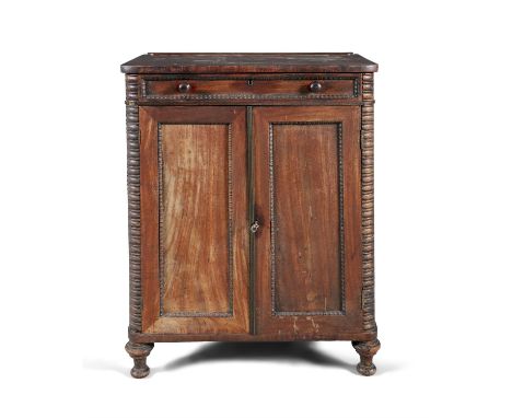 A GEORGE IV MAHOGANY SIDE CABINET, by Gillingtons, Dublin, a slender frieze drawer with beaded border above twin fielded cupb