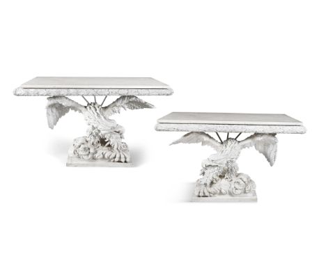 A PAIR OF GEORGE III STYLE CARVED WHITE PAINTED TIMBER CONSOLE TABLES, the marble tops with carved bound acanthus leaf bandin