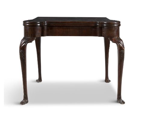 A GEORGE III MAHOGANY SHAPED RECTANGULAR FOLDING TOP CARD TABLE, c.1760, with rounded corners, the interior baise lined and w