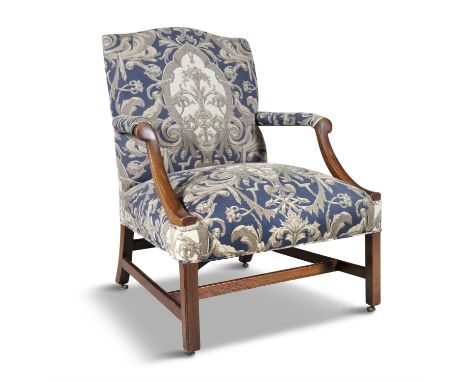 A GEORGE III MAHOGANY FRAMED UPHOLSTERED GAINSBOROUGH ARMCHAIR, in the Chippendale taste, the arched panel back, armrests and