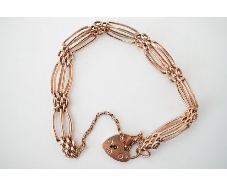 A 9ct rose gold gate-link bracelet with heart-shaped padlock clasp, 15.7g