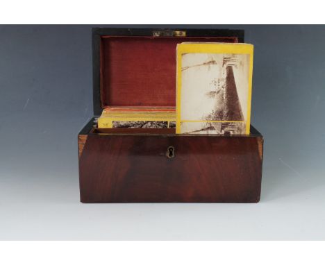 A Victorian rosewood tea caddy containing a quantity of stereograph views of America and Britain, including Central Park New 